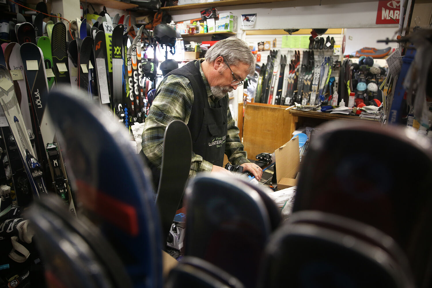 Luke Todd adds bindings onto a set of skis